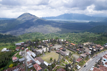 Fototapeta na wymiar Aerial view of Pura Ulun Danu Batur hindu temple, Mount Batur and Lake Batur. Kintamani, Bali, Indonesia.