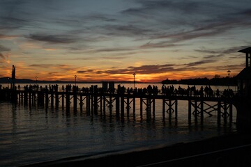 Fototapeta na wymiar Beautiful view of a sunset over the pier.