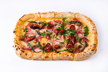 pizza with smoked beef, dried tomatoes, mushrooms and arugula on a white background