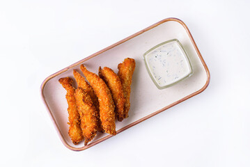 Nuggets with garlic sauce on a white background