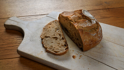 Fresh bio bread on a wooden board.