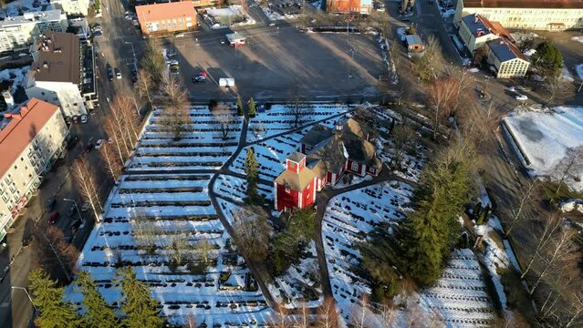 Drone shot over a church in small Finnish town in winter