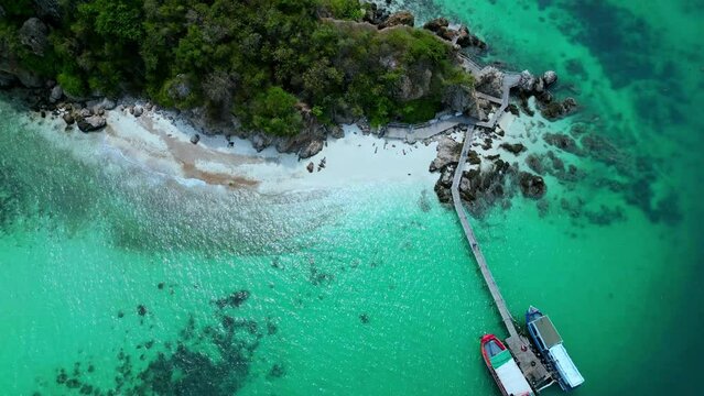 Drone footage. Thailand Isand Ko Kham near Pattaya - The Emerald Island.
This is a tiny island that is located 35 km from the coast of Pattaya and just 1 km from Koh Mak. 