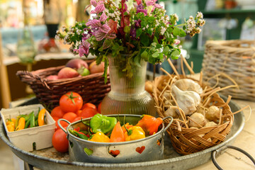 Big tray with various fruits vegetables and flowers