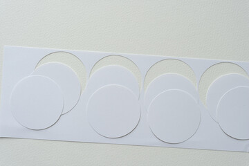 white paper circles on blank paper