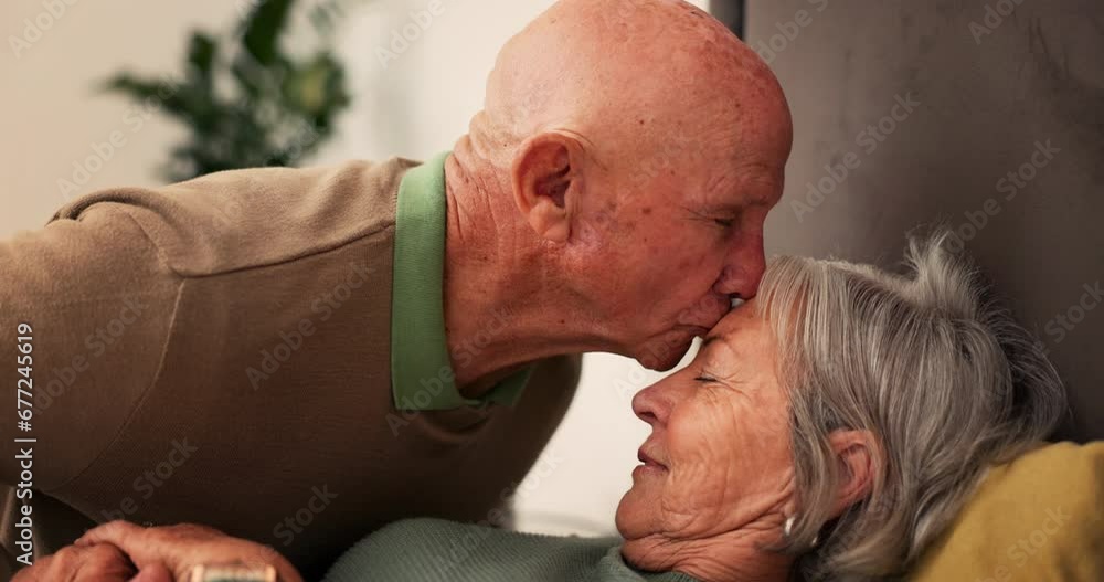 Poster Bed, sick and senior couple kiss forehead for support, bonding and compassion together at home. Retirement, marriage and elderly man and woman embrace in bedroom for illness, healing and recovery