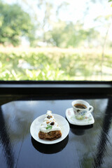 Dessert and coffee on black table