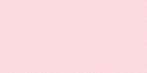 Seamless white polka dot pattern on pink background