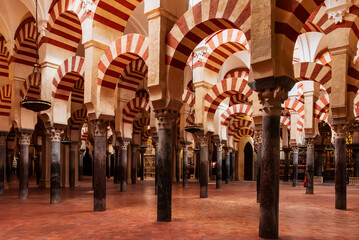 Striped arches and pillars in the prayer room inside the cathedral mosque of Cordoba, Andalusia.