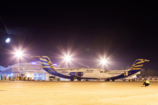 Bishkek, Kyrgyzstan - September 26, 2023: TezJet Air Company EX-27005 plane at the Manas International Airport at night