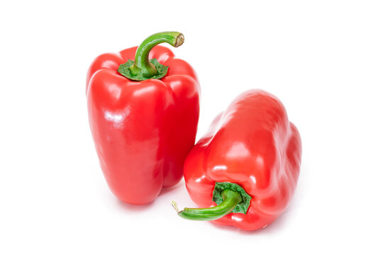 Two Fresh Red Sweet Bell Peppers Isolated on White Background