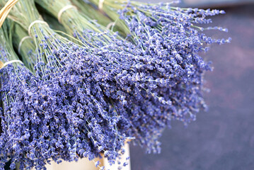 Nice. French market. Close up view of dried lavender flowers with bracts. Light purple colour. Pattern of small natural violet elements. Aromatic mediterranean product. - obrazy, fototapety, plakaty