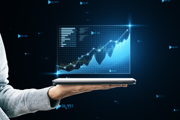 Hand presenting a 3D financial growth chart on a tablet