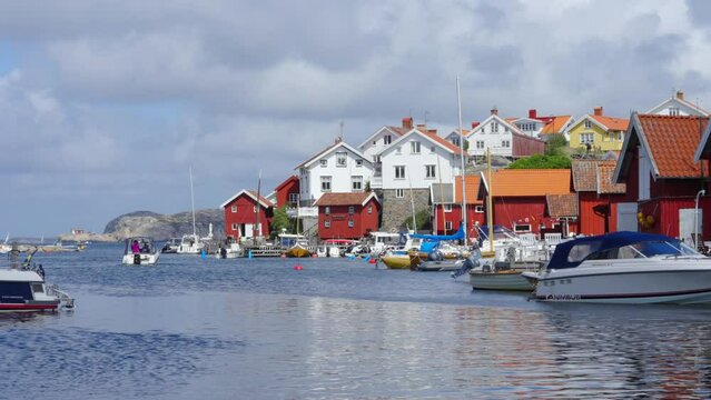 Seaside fishing village in Sweden. Haven carved by rugged coastline