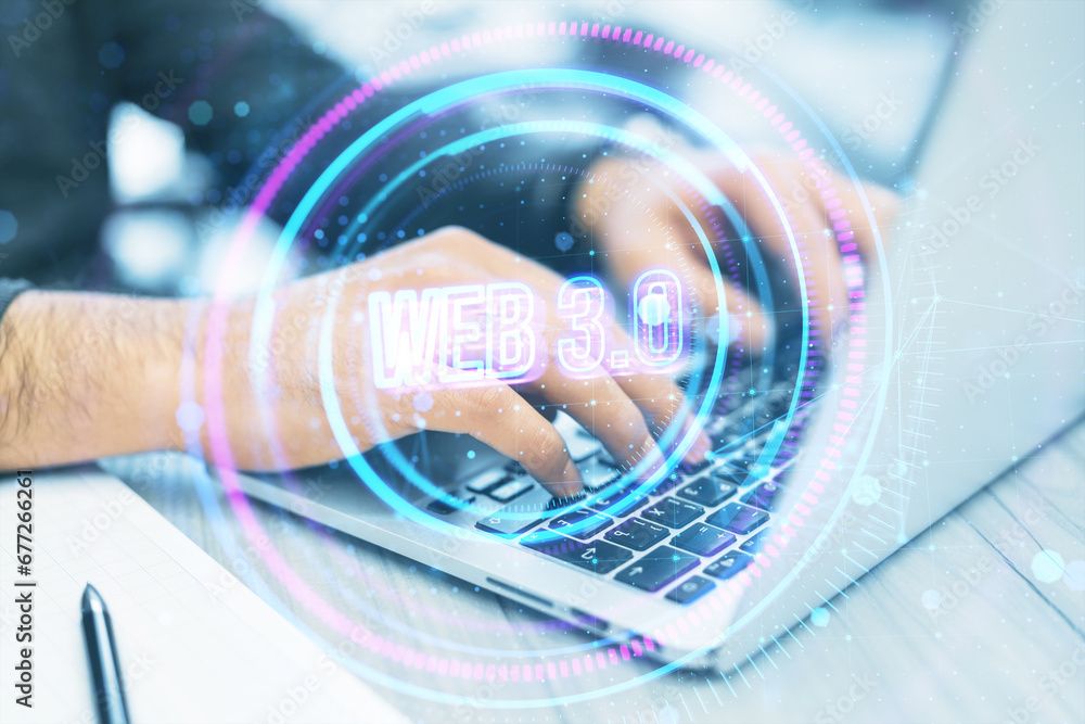 Poster close up of man hands using laptop on desk with supplies and creative glowing round web 3.0 hologram