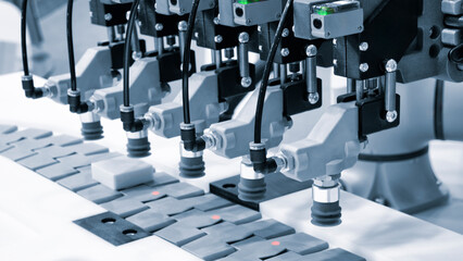 Fragment of the conveyor of sticking labeling machine. Abstract industrial background.