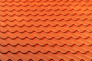Orange metallic roof tile pattern as background
