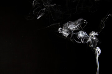 White Smoke Cigarette in Dark Background