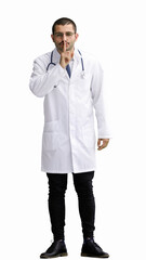 male doctor in a white coat on a white background shows a sign keep quiet