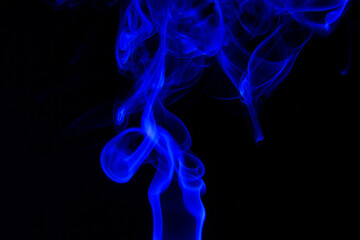 Fototapeta premium blue Smoke in cigarette in dark Background