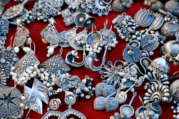 colorful traditional indian jewelry displayed in a street shop for sale in Pune, Maharashtra. Indian art, Indian artificial jewelry.