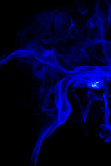 Fototapeta premium blue Smoke in cigarette in dark Background