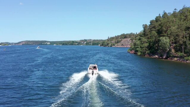 Boat cursing in archipelago Stockholm Sweden. Sunny summer day on blue water