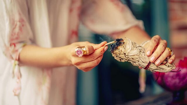 incense in a woman hand, ceremony space. Loop Animation.