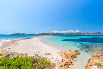 A man sitting at Passetto beach, Tavolara island, Olbia area, Sardinia, Italy, Europe