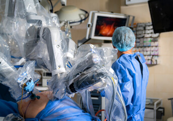 Operation robotic medical process. Futuristic surgery with robot arms.