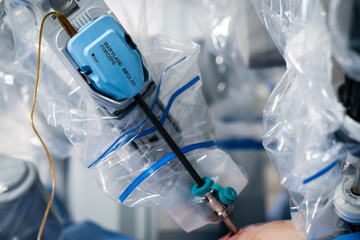 Robotic medical arms working. Surgeons with artificial intelligence.