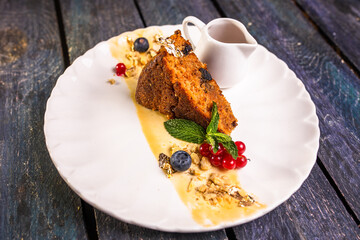 a piece of sponge cake on a plate. dessert in the restaurant photo for the menu