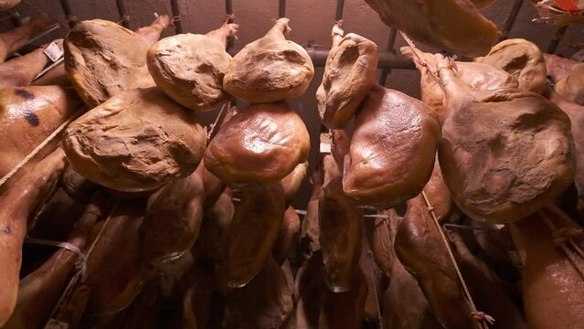 Jamon serrano pig legs factory hanging in a industry. Iberian ham elaboration process