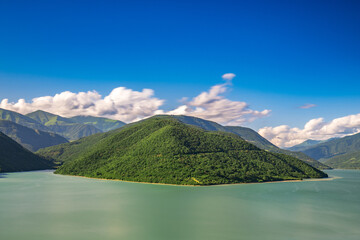 Georgia's Zhinvali Reservoir: A Visual Symphony of Lakeside Splendor and Majestic Caucasus lake in...
