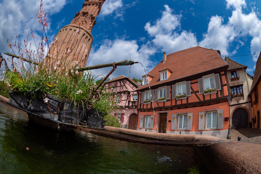 the colorful half timbered building in the streets of the beautiful Alsace village Riquewihr