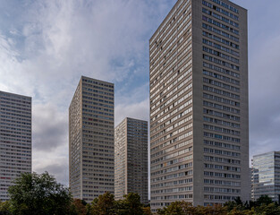 Fototapeta na wymiar Ivry-Sur-Seine, France - 09 20 2021: View of vertiginous and vertical gray buildings .