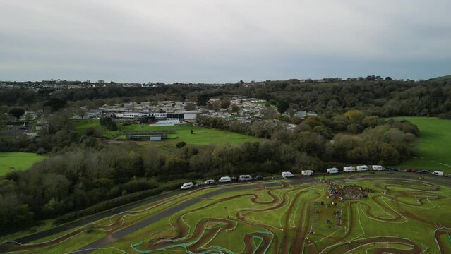 Paignton, Torbay, South Devon, England: DRONE VIEWS: A cyclo-cross cycling event at Torbay VeloPark; Hoburne Holiday Park in b/g. Torbay is a popular UK holiday resort with many tourist attractions.