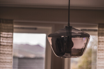Fototapeta na wymiar Illuminating Space: Ceiling Mirror Lamp in the Room