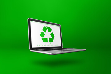 Laptop computer with a recycling symbol on screen. environmental conservation concept