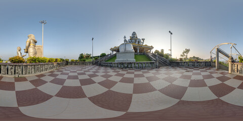 full 360 hdri panorama near tallest hindu shiva statue in india on mountain near ocean in...