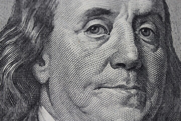 Closeup of Ben Franklin on a one hundred dollar bill for background