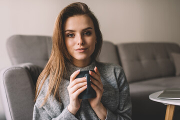 Calm woman with cup of coffee