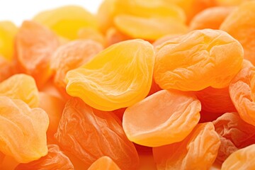 A pile of dried apricots sitting on top of each other.
