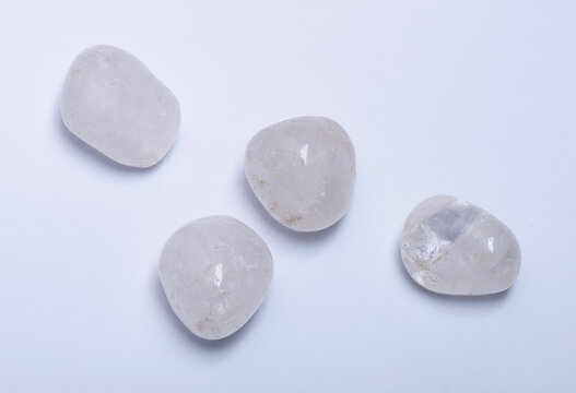 Tumbled Clear Crystal Quartz Stones isolated on white