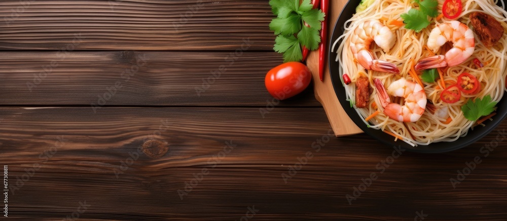 Poster asian rice noodles with shrimp vegetables on table top view copy space image place for adding text o