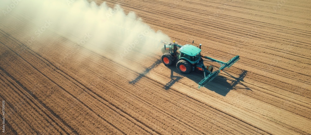 Poster aerial view of red tractors sowing and spraying in agricultural field copy space image place for add