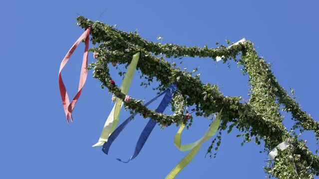 Midsummer pole on mid summer eve in Sweden. Traditional Swedish culture symbol
