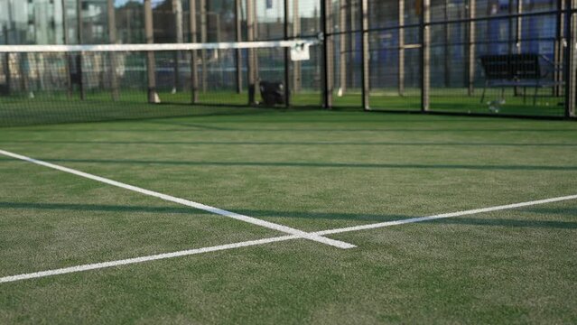 Padel court net and white painted lines. Net and fence courts in city