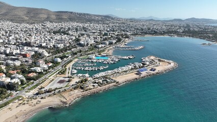 Aerial drone photo of seaside touristic area with paradise beaches and modern architecture of Glifada, Athens riviera, Attica, Greece