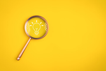 Magnifying glass with light bulb icon on background for creative idea concept, Innovative solution...